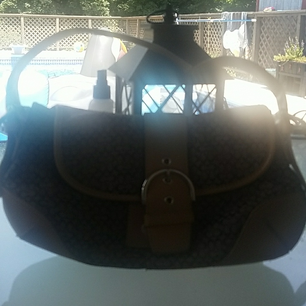 Dark brown and tan leather Coach purse.